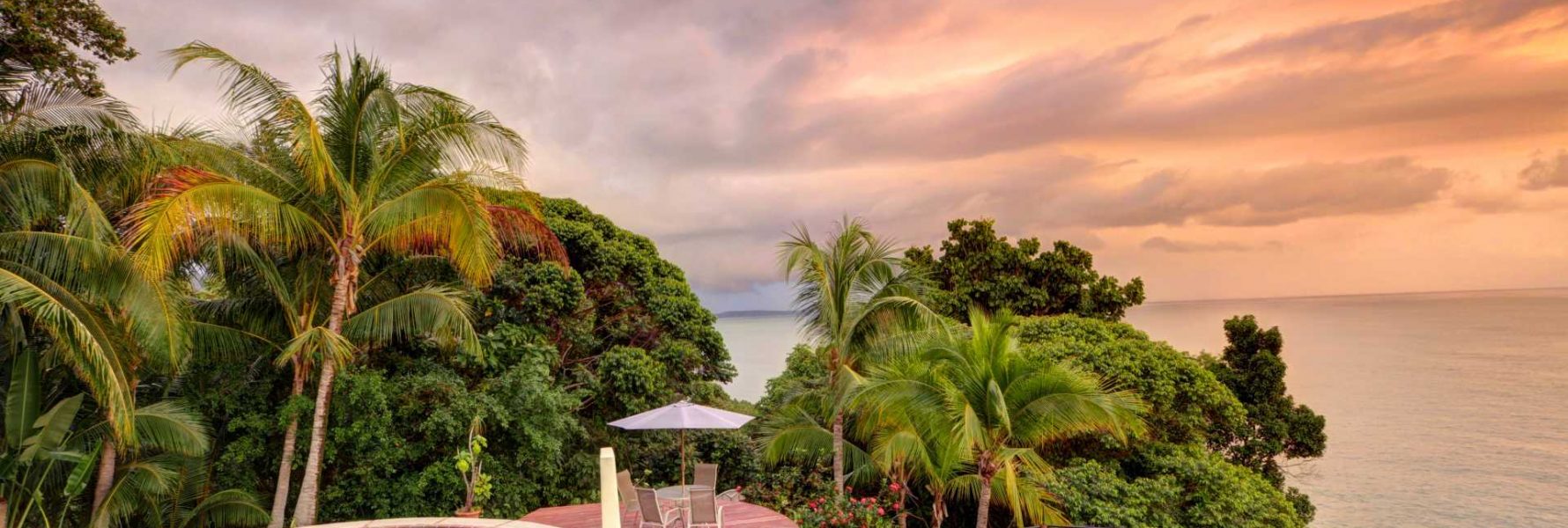 The large private pool and two decks have stunning panoramic ocean and rainforest views.