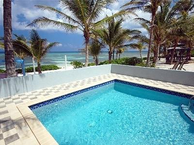 Beachfront luxury villa rental on Grand Cayman Island with oceanview private pool and spacious sundeck
