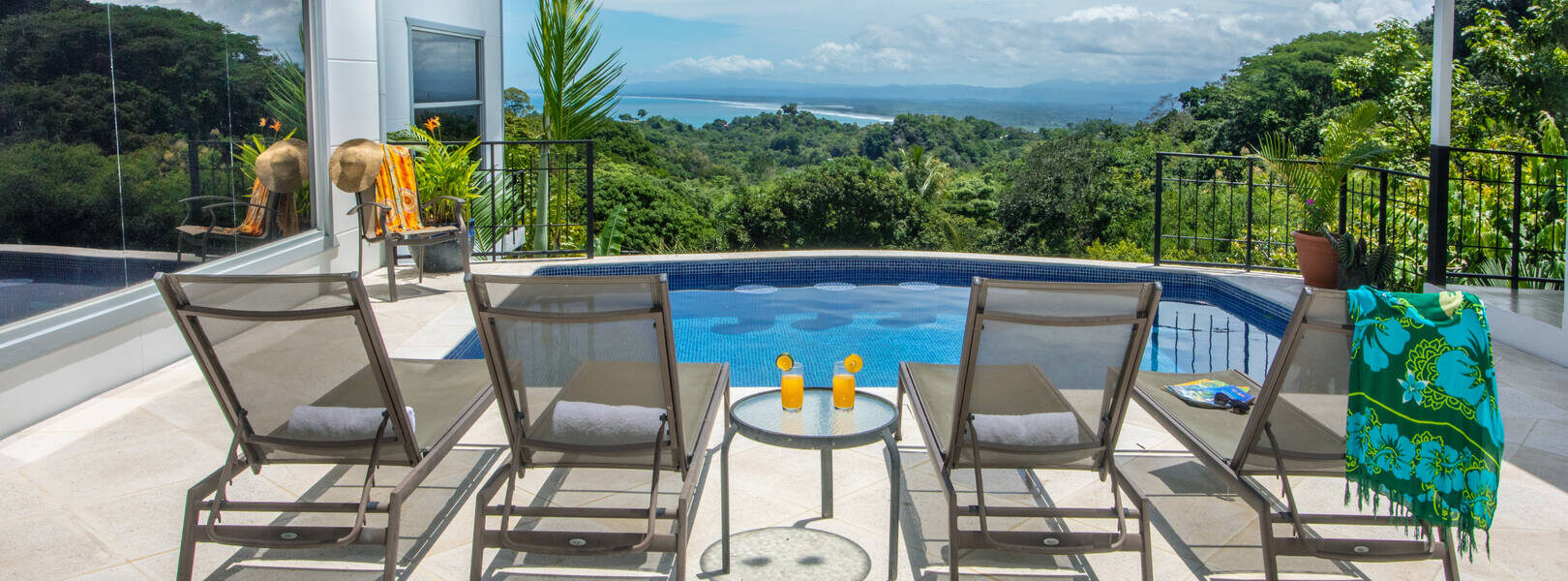 The property has a beautiful pool with underwater seating. The perfect spot to sit and admire the jungle.