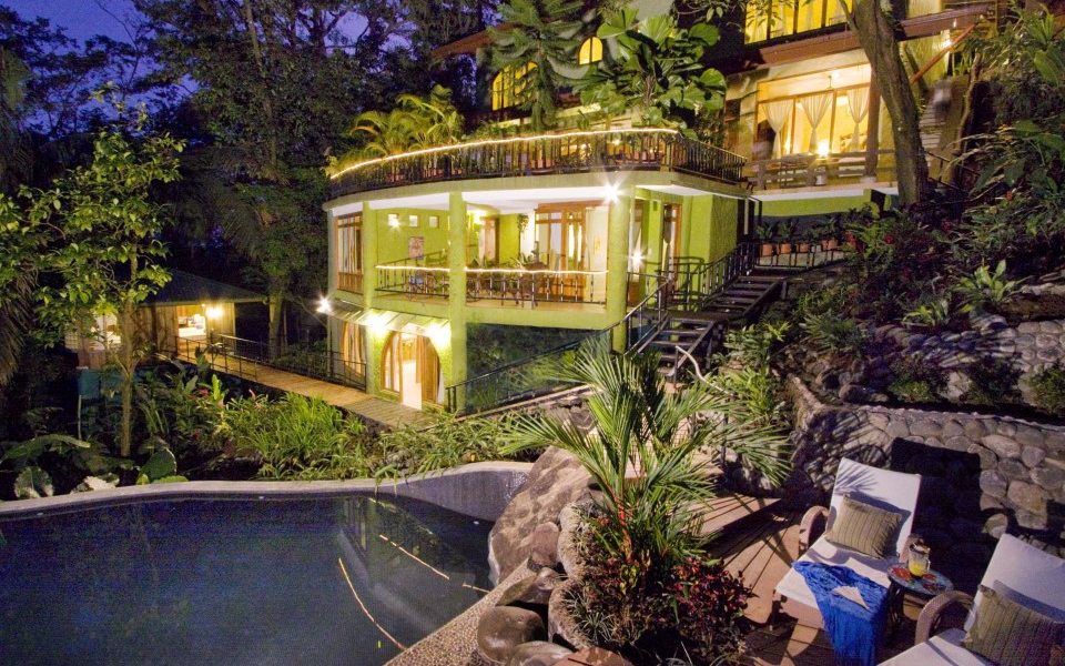 Evening view of all five levels of this luxury villa as the pool shimmers under the magical lighting.