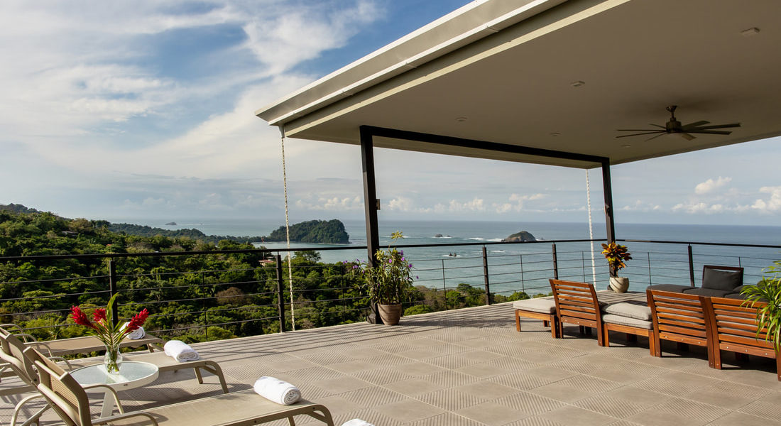 The upper level of this remarkable Manuel Antonio vacation villa offers numerous options for lounging in either the shade or the sunlight, all while enjoying stunning panoramic views.