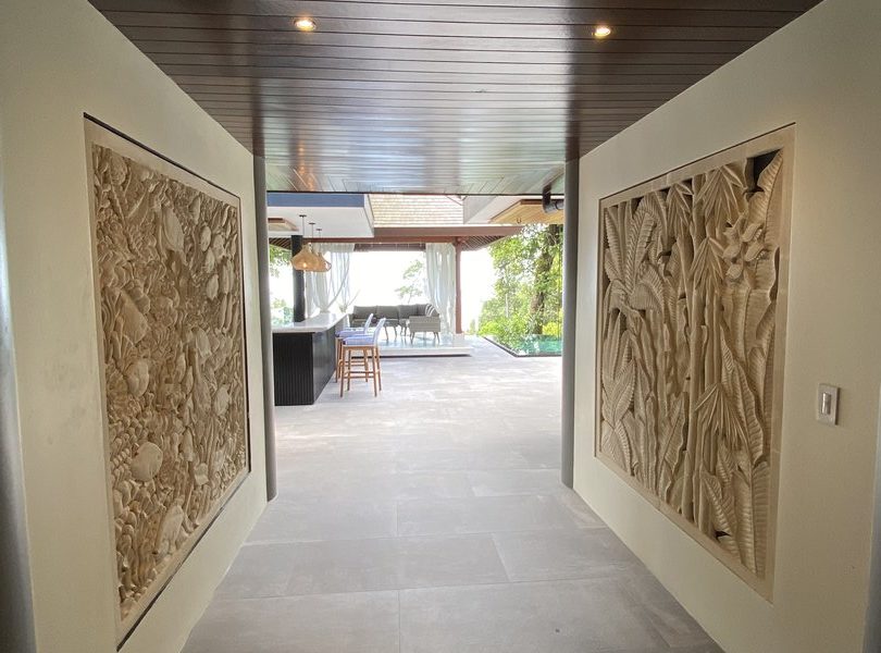 The entrance to the house has some beautifully handcrafted stone murals.