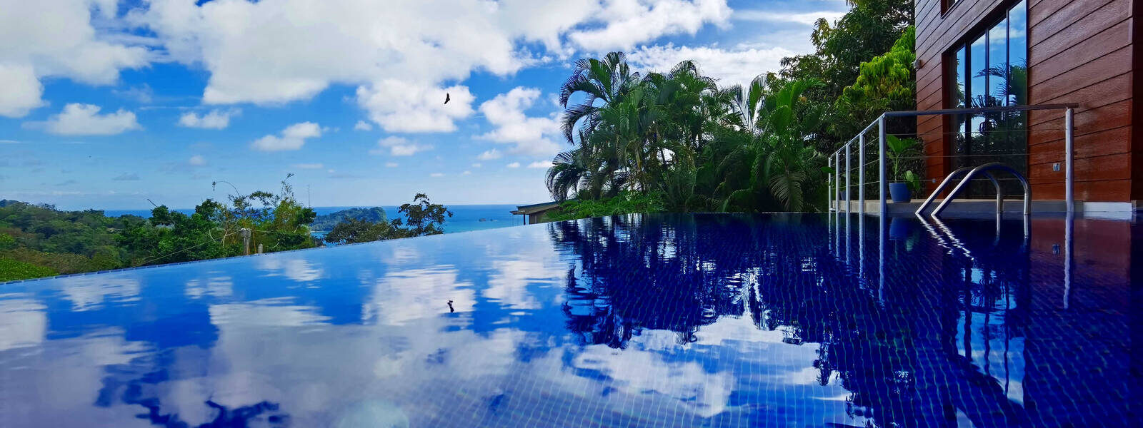 The gorgeous inviting crystal-clear infinity pool is the highlight of this stunning Manuel Antonio villa.
